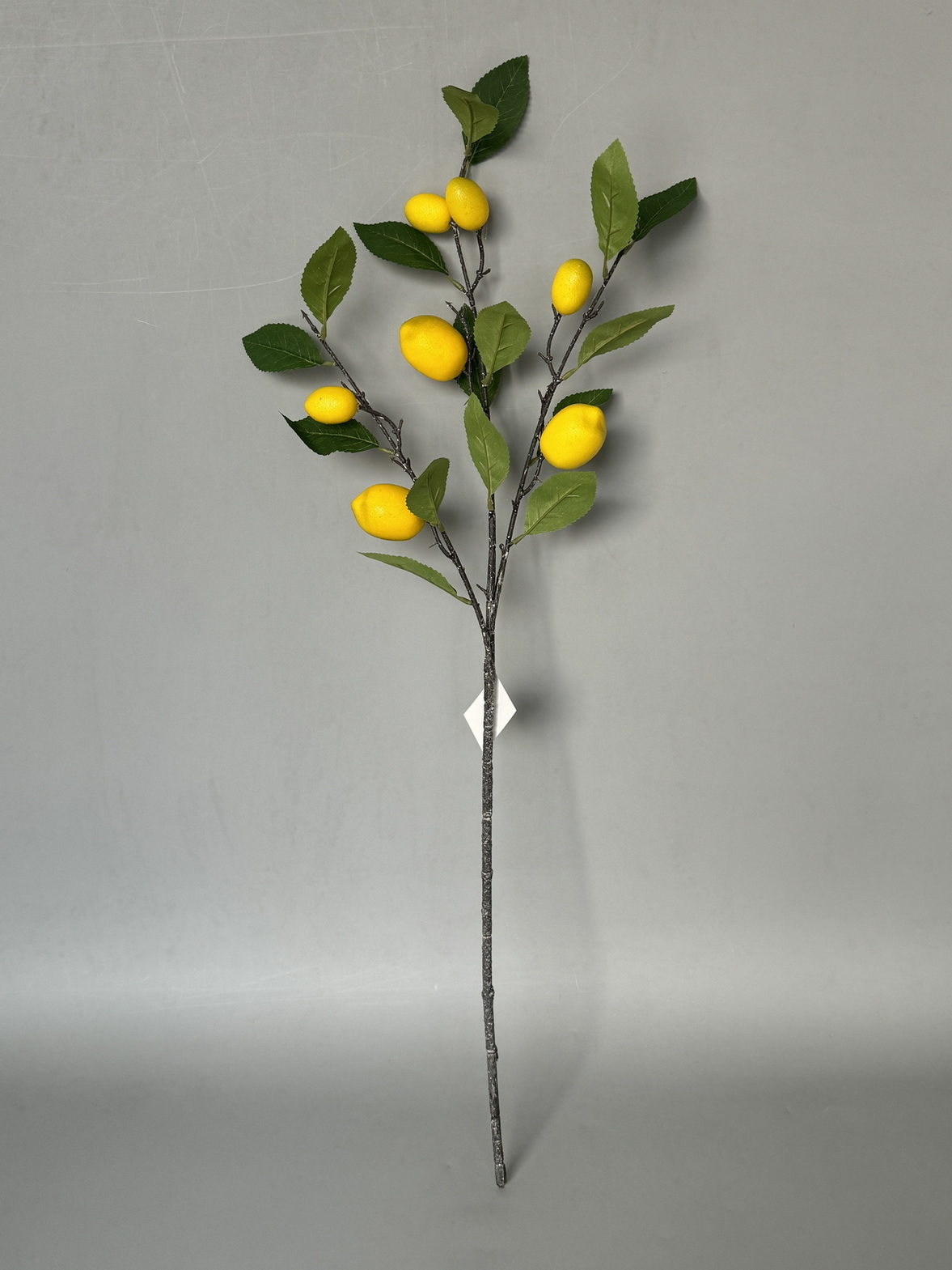 Цветок искусственный Ветка Лимон 85см, желтый по цене 